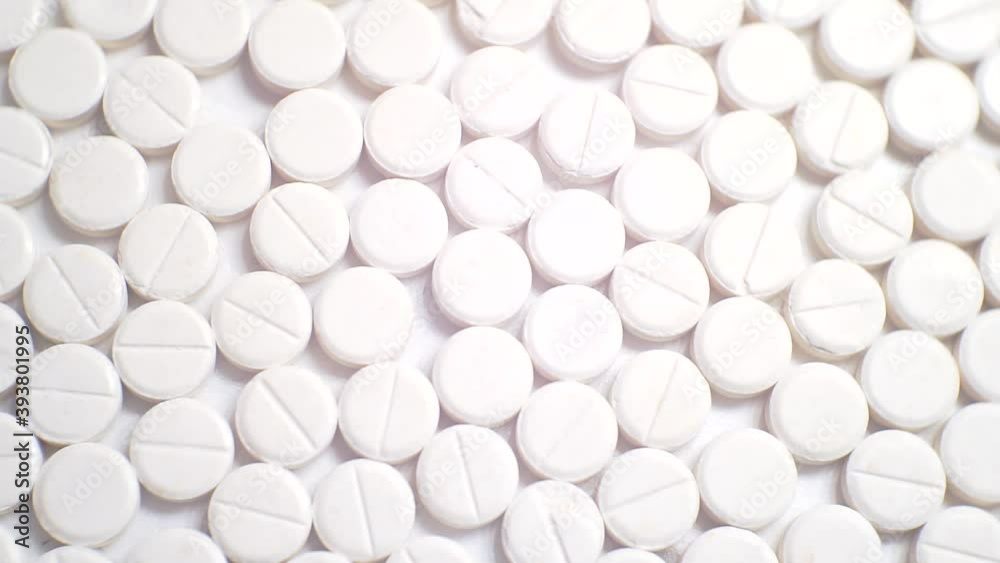 white pills close up.drugs on the production line.top view white pills close up.drugs on the production line.top view