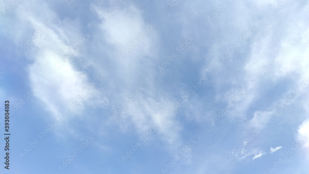 Obraz premium White Fluffy Clouds with Blue Sky Background.