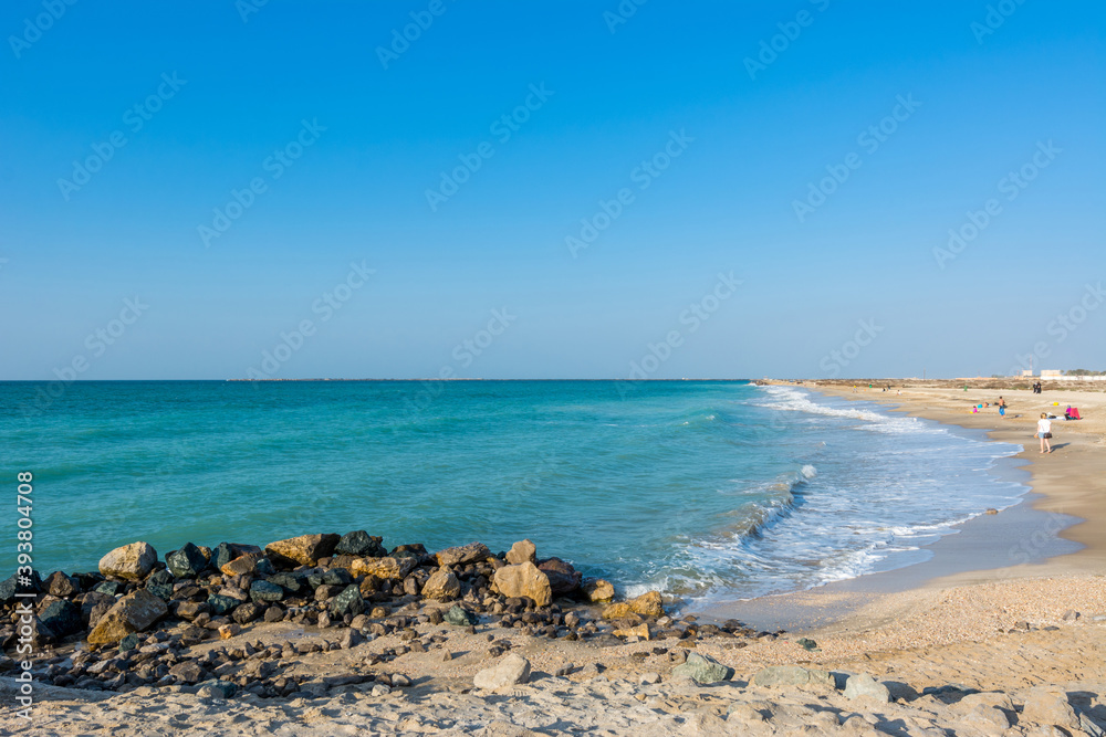 Waves flushing the beach at Ras Al Khaimah, UAE