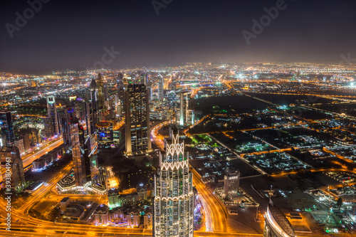 Night aerial view of Dubai from the top of Burj Khalifa Tower in Dubai, United Arab Emirates, the tallest building in the world.
