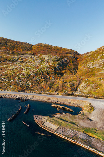 Cemetery of old ships in Teriberka Murmansk Russia  dramatic photo. Aerial top view.