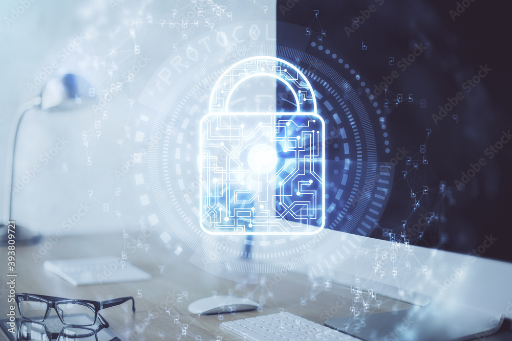 Double exposure of desktop with computer and lock icon hologram. Concept of data safety. Double exposure of desktop with computer and lock icon hologram. Concept of data safety.