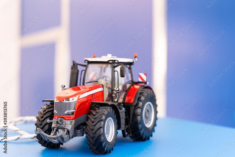 Obraz premium Small agricultural tractor side view