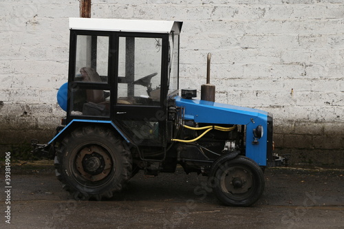 old russian tractor in the parking lot
