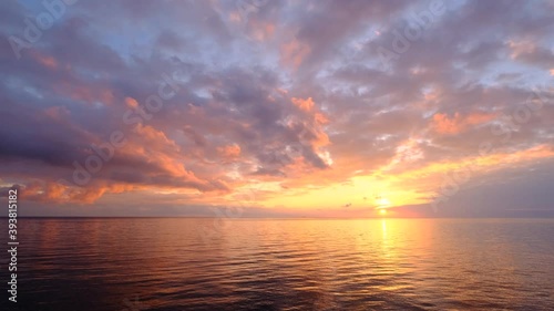 magical beautiful sunset on the beach. the sun dives into the golden waves. incredible sea landscape. Seascape, Summer and travel vacation concept photo