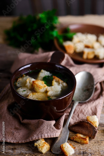 Chicken broth with croutons.style rustic