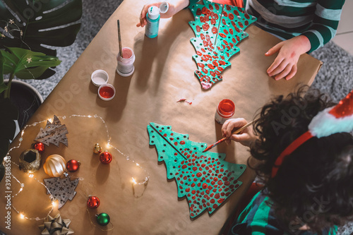 little kids making christmas decorations