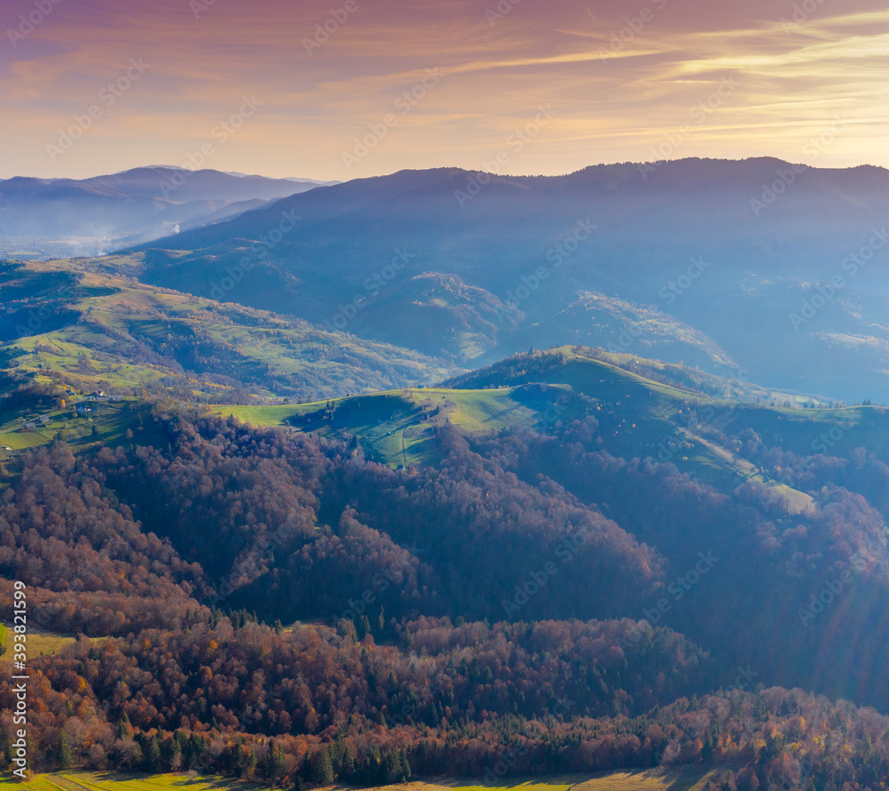 Obraz premium Silhouette of mountains in the early foggy morning. Mountain view in autumn. Beautiful natural landscape. View from above. Carpathian mountains. Ukraine