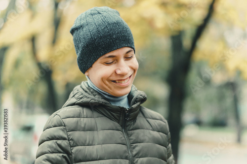 happy teen boy posing outdoor, autumn season, city street