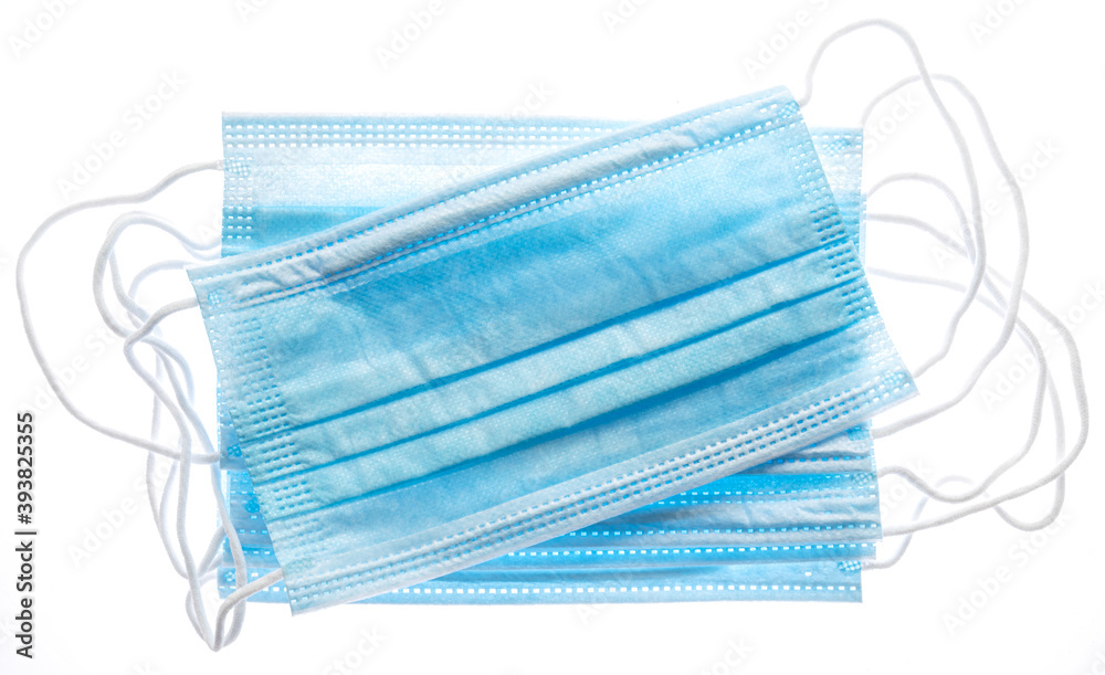 Medical masks isolated on white background. A persistent attribute of the Covid-19 pandemic. Medical masks isolated on white background. A persistent attribute of the Covid-19 pandemic.