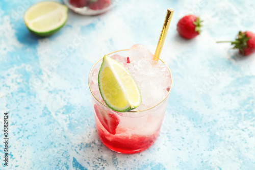 Glass of fresh strawberry lemonade on light table