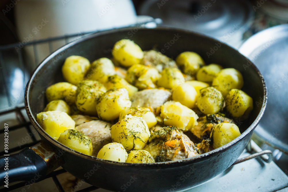 Young potatoes roasted in old village kitchen . Selective focus. Shallow depth of field.
Young potatoes roasted in old village kitchen . Selective focus. Shallow depth of field.