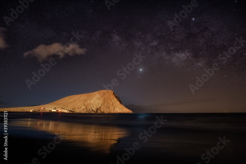 mountain with beach and milky way night photo