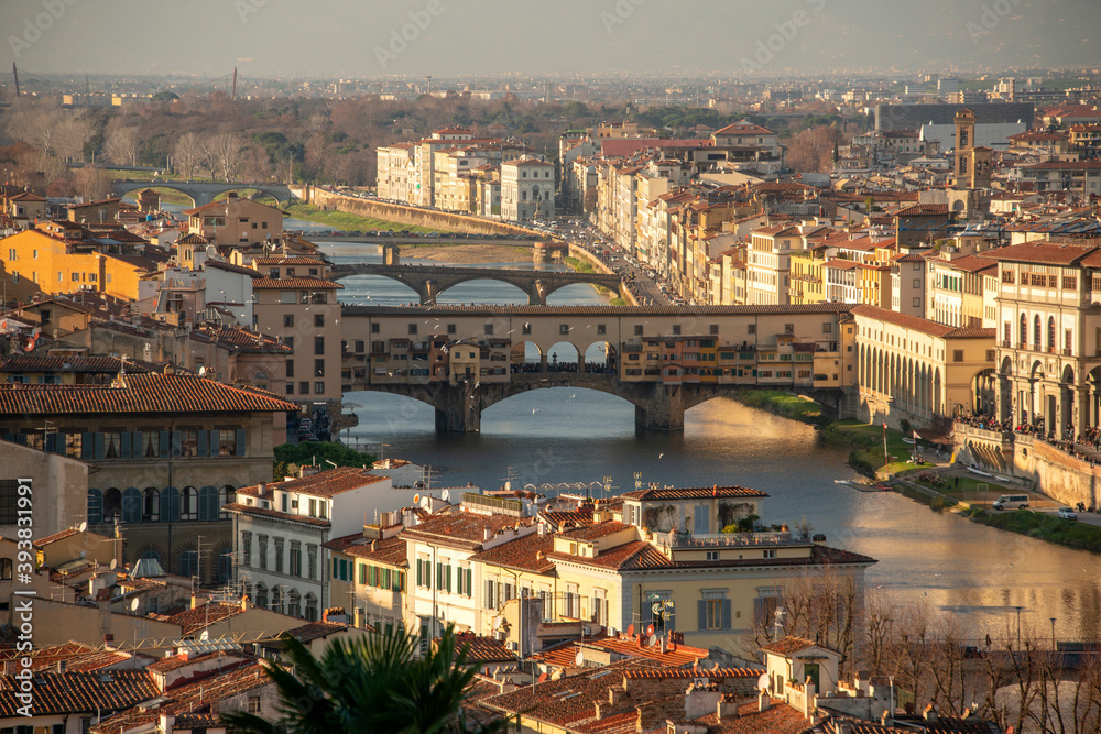 Florence at sunset with Arno river and Ponte Vecchio