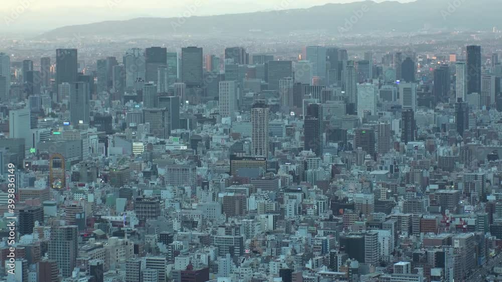 OSAKA, JAPAN : Aerial high angle sunrise view of CITYSCAPE of OSAKA. View of buildings and street around Namba, Shinsaibashi, Umeda and Osaka station. Zoom in time lapse shot, night to morning. OSAKA, JAPAN : Aerial high angle sunrise view of CITYSCAPE of OSAKA. View of buildings and street around Namba, Shinsaibashi, Umeda and Osaka station. Zoom in time lapse shot, night to morning.