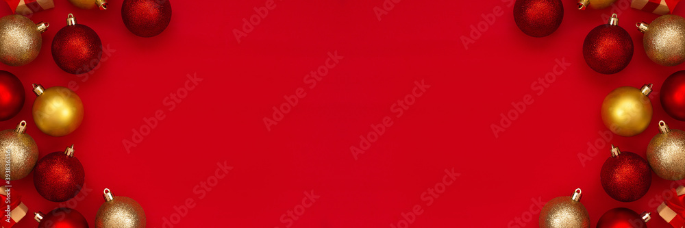 Red and gold Christmas balls decorations on a red background with copy space.Christmas composition. Flat lay, top view. Minimalistic style. Red and gold Christmas balls decorations on a red background with copy space.Christmas composition. Flat lay, top view. Minimalistic style.