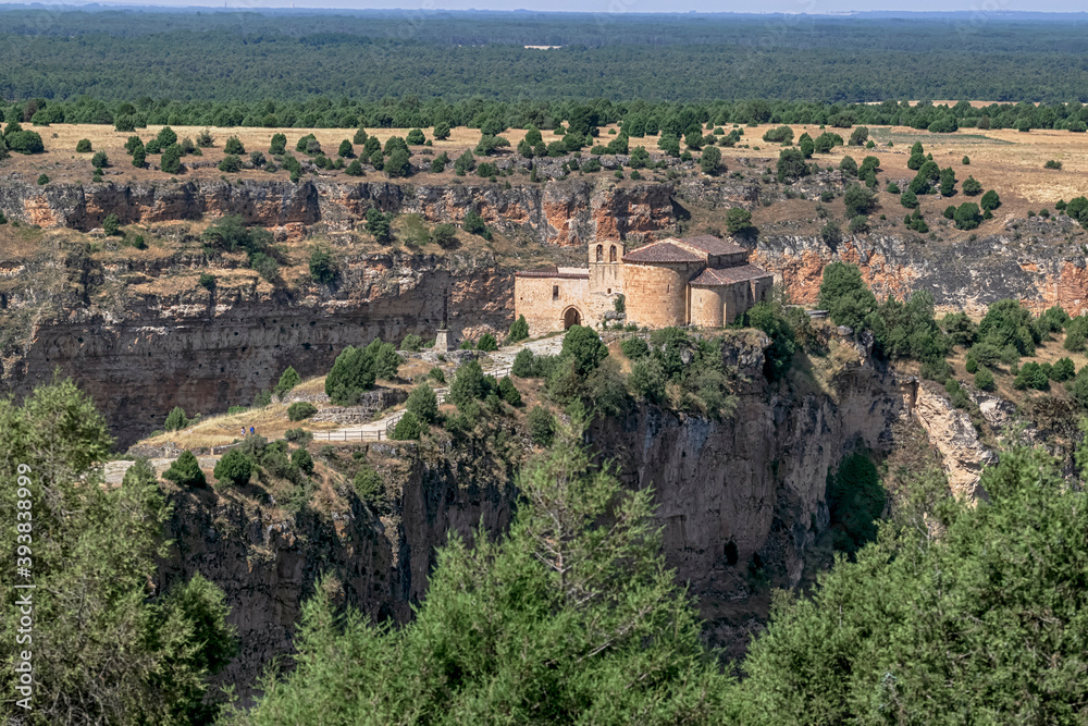 In the Natural Park of the Hoces of River Duraton view of the Hermitage of San Frutos on a precipice. Photograph taken in Segovia, Spain.