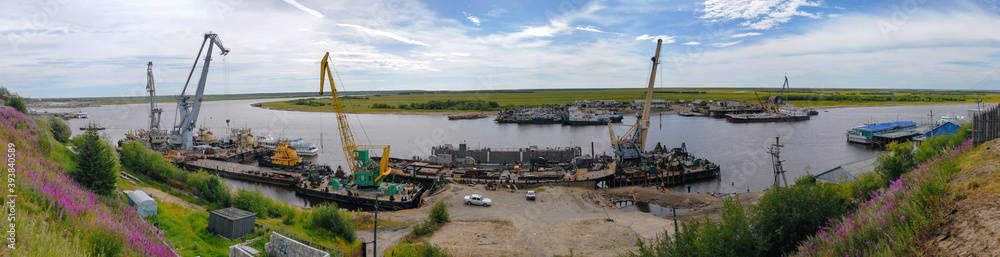 Fototapeta premium View at the port on Poluy river. Salekhard, Yamalo-Nenets Autonomous Okrug (Yamal), Russia.