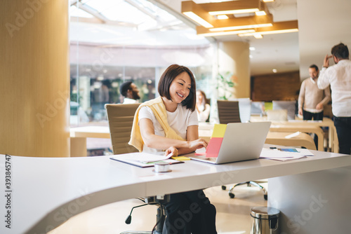 Asian woman working on laptop in office