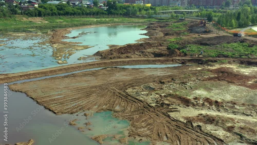 Drained lake as viewed by dron. Aerial view of drainage of the construction site. Cleaning the