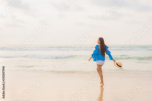 Portrait beautiful young asian woman relax leisure smile around beach sea ocean