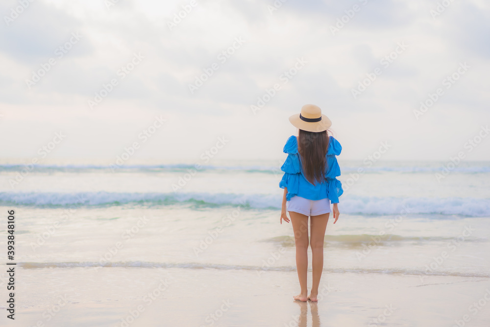 Portrait beautiful young asian woman relax leisure smile around beach sea ocean