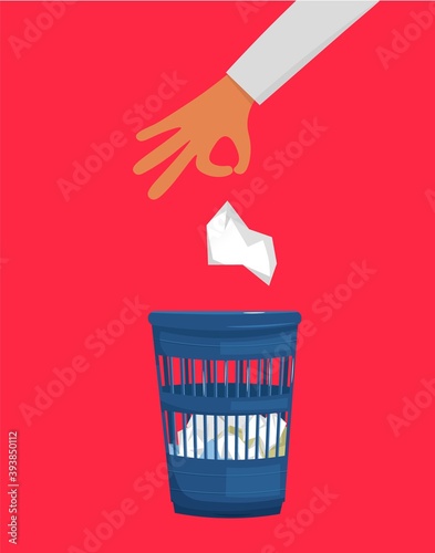 A hand throwing crumpled paper to trash