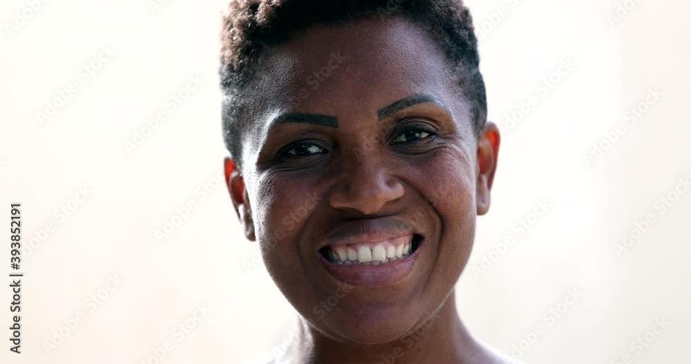 Portrait African american woman smiling at camera Portrait African american woman smiling at camera