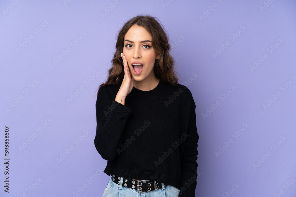 Young woman over isolated purple background with surprise and shocked facial expression Young woman over isolated purple background with surprise and shocked facial expression
