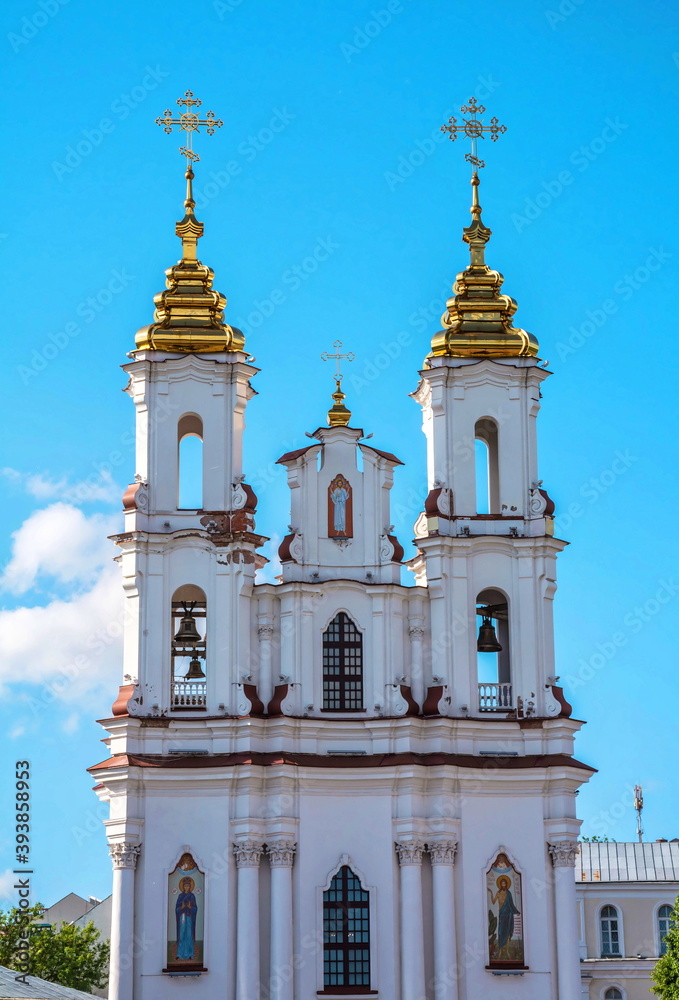 Fototapeta premium Towers of the Church of the Transfiguration in the Gothic style in the city of Vitebsk