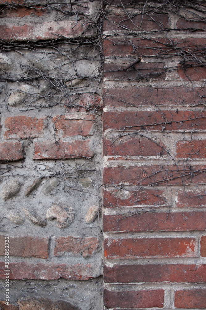 Old brick destroying wall. Fragment of the wall of baked brown brick in. Close-up. Texture. Background. Old brick destroying wall. Fragment of the wall of baked brown brick in. Close-up. Texture. Background.