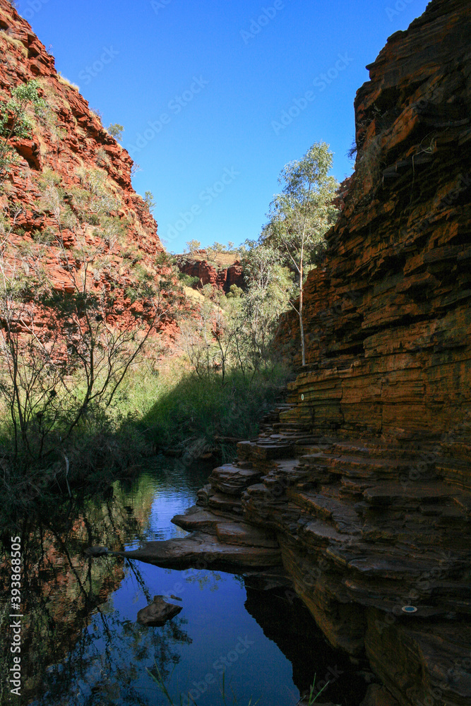 Hiking and swimming in Karijini National-Park, Western Australia with beautiful rock formations