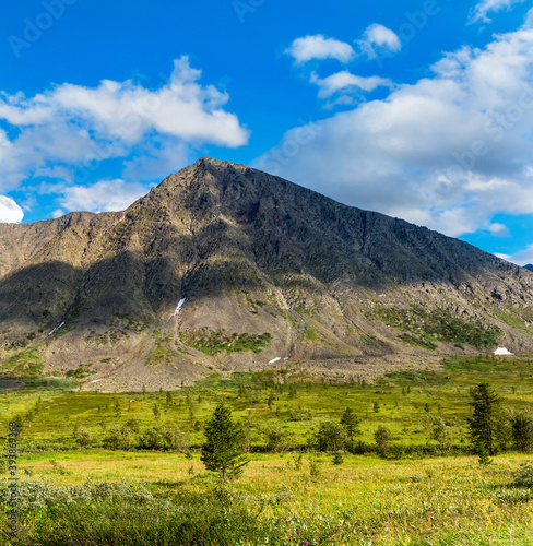 valley and mountains in the subpolar urals on a summer day