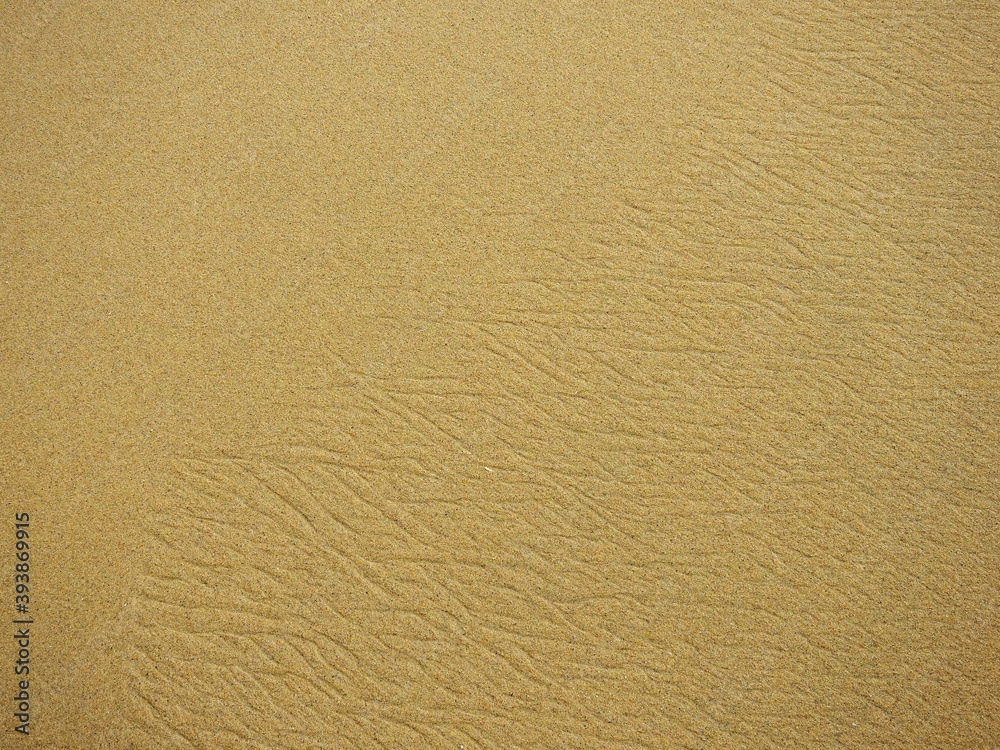 wet sand on the beach after low tide, texture background wet sand on the beach after low tide, texture background