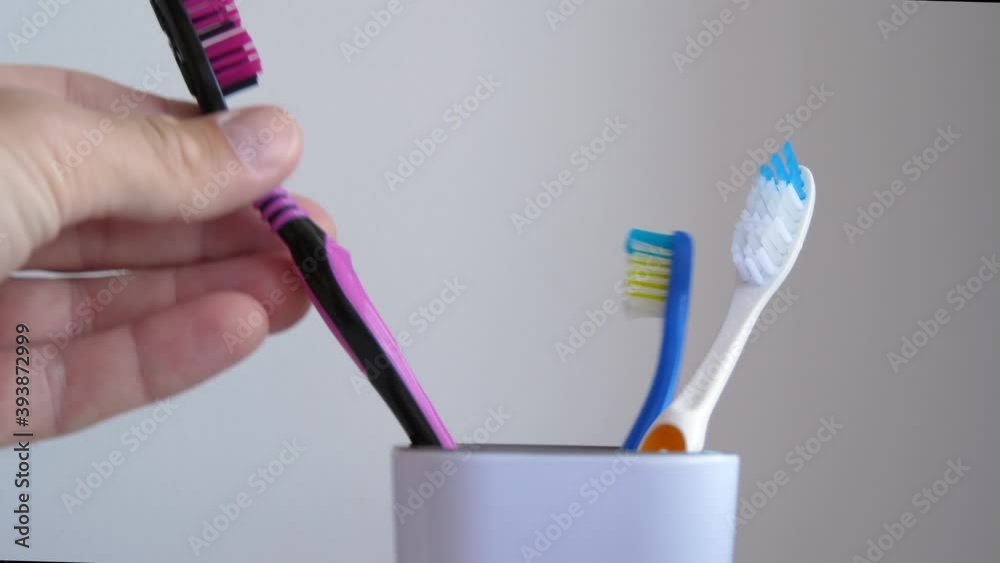 A man uses a toothbrush. The health of teeth. Care and hygiene. A man uses a toothbrush. The health of teeth. Care and hygiene.
