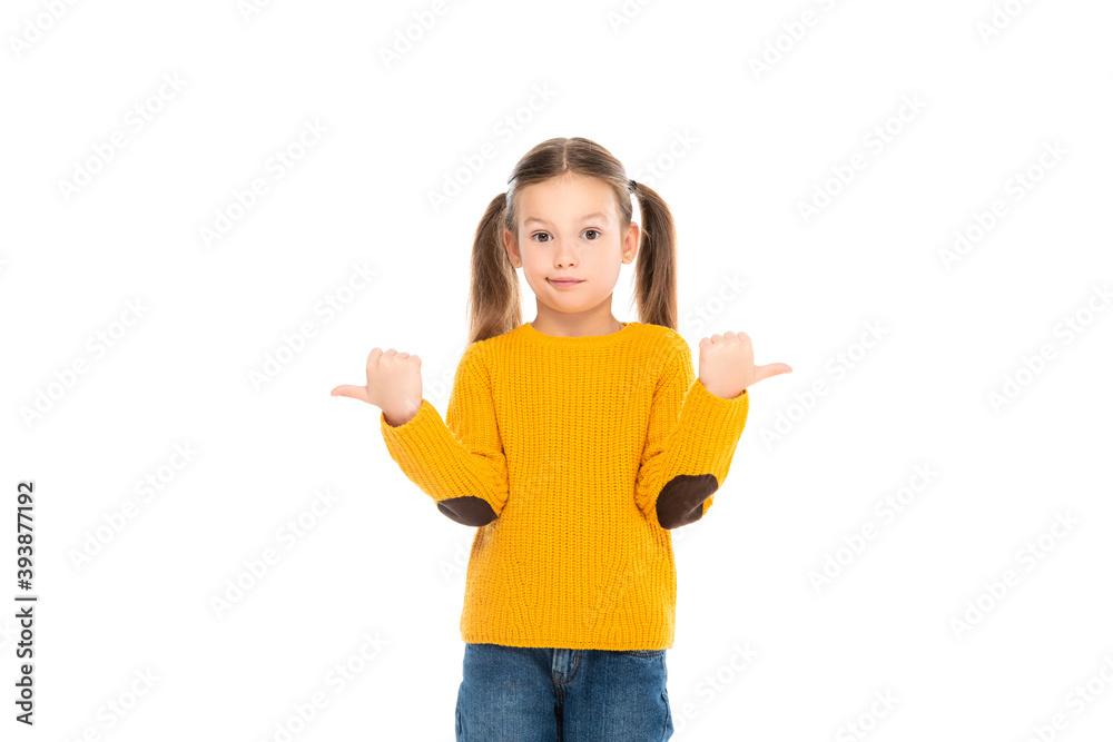 Confused kid pointing away while looking at camera isolated on white Confused kid pointing away while looking at camera isolated on white