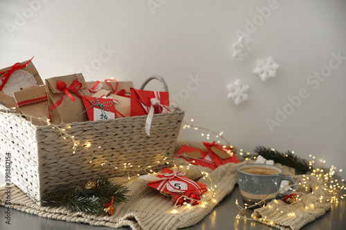 Set of gifts, coffee and Christmas decor on table. Advent calendar