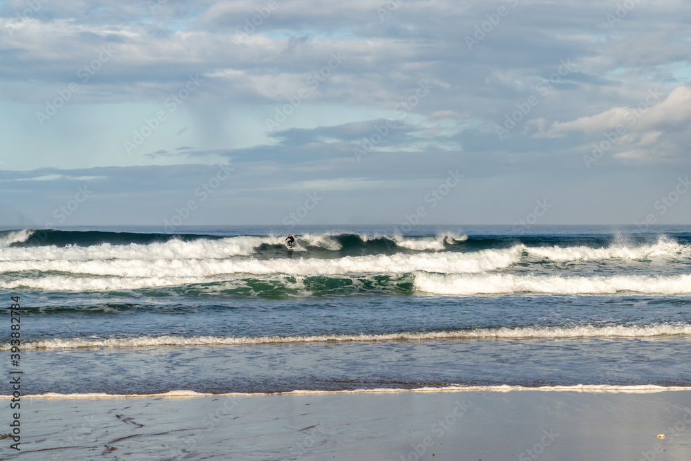 surfing at A Frouxeira beach in Galicia in northern Spain