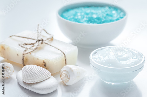 sea salt  soap and body cream on white desk background