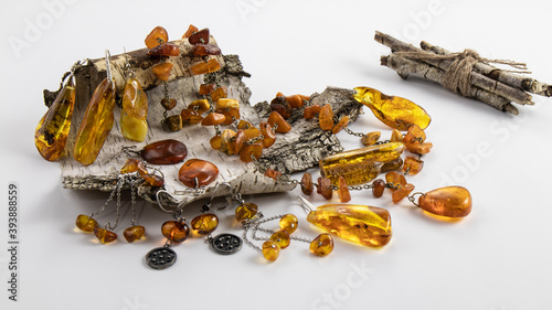 Wallpaper Mural amber necklace and earringsSparkling unique vintage  jewelry made of natural Baltic amber in silver in the form of earrings, pendant, necklace lie on white old birch bark.  Torontodigital.ca