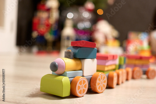 Toy train constructor made of wooden blocks. Close up.