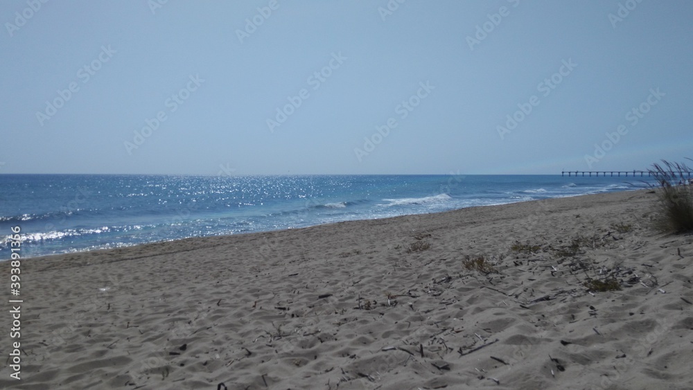 Calm sea and empty beach
Bulgaria. Black Sea. Deserted sandy beach under a gray-blue sky. Sea waves run ashore. The water under the sky is blue with reflections.
