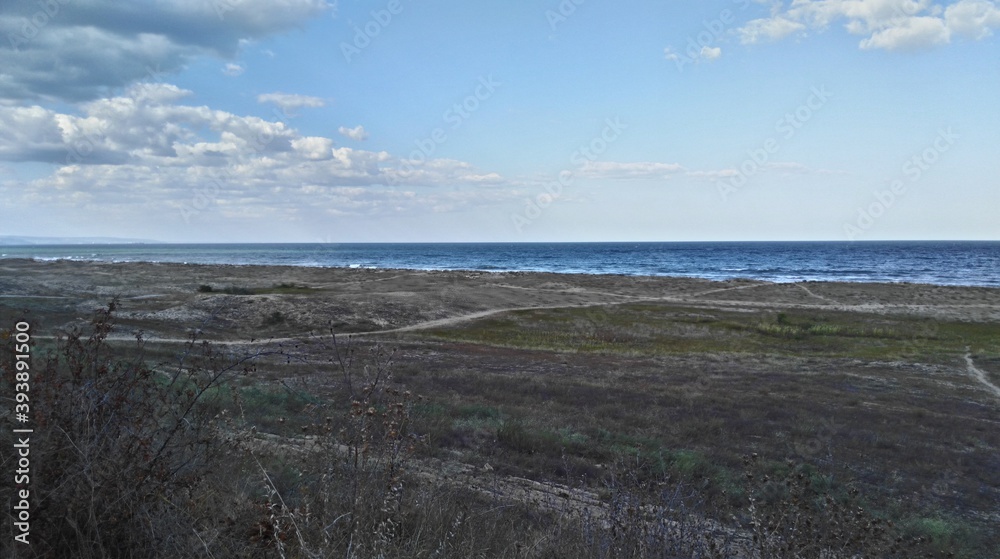 Distant strip of sea water
Bulgaria, Black Sea. Summer day. Coastal vegetation by the sea. The ground is grass. Well-worn sandy paths go to the sea Distant strip of sea water
Bulgaria, Black Sea. Summer day. Coastal vegetation by the sea. The ground is grass. Well-worn sandy paths go to the sea