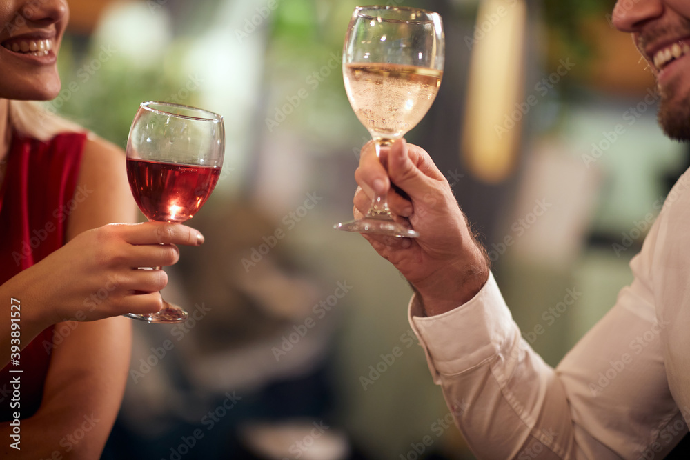 A young couple in love having a drink at Valentine's day celebration in a restaurant. Together, Valentine's day, celebration A young couple in love having a drink at Valentine's day celebration in a restaurant. Together, Valentine's day, celebration