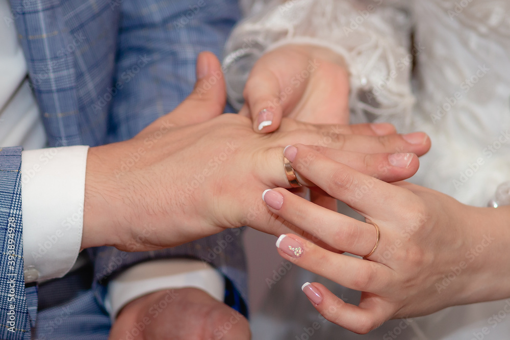 Hands. Newlyweds exchange wedding rings Hands. Newlyweds exchange wedding rings