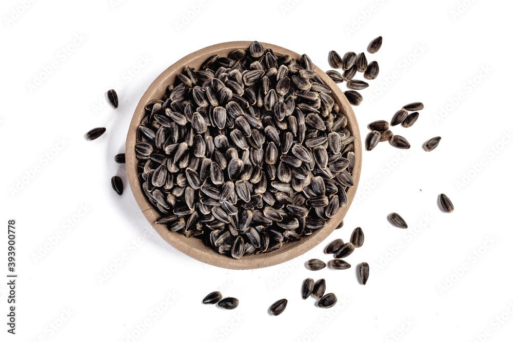 Sunflower seeds in a plate on a white background Sunflower seeds in a plate on a white background