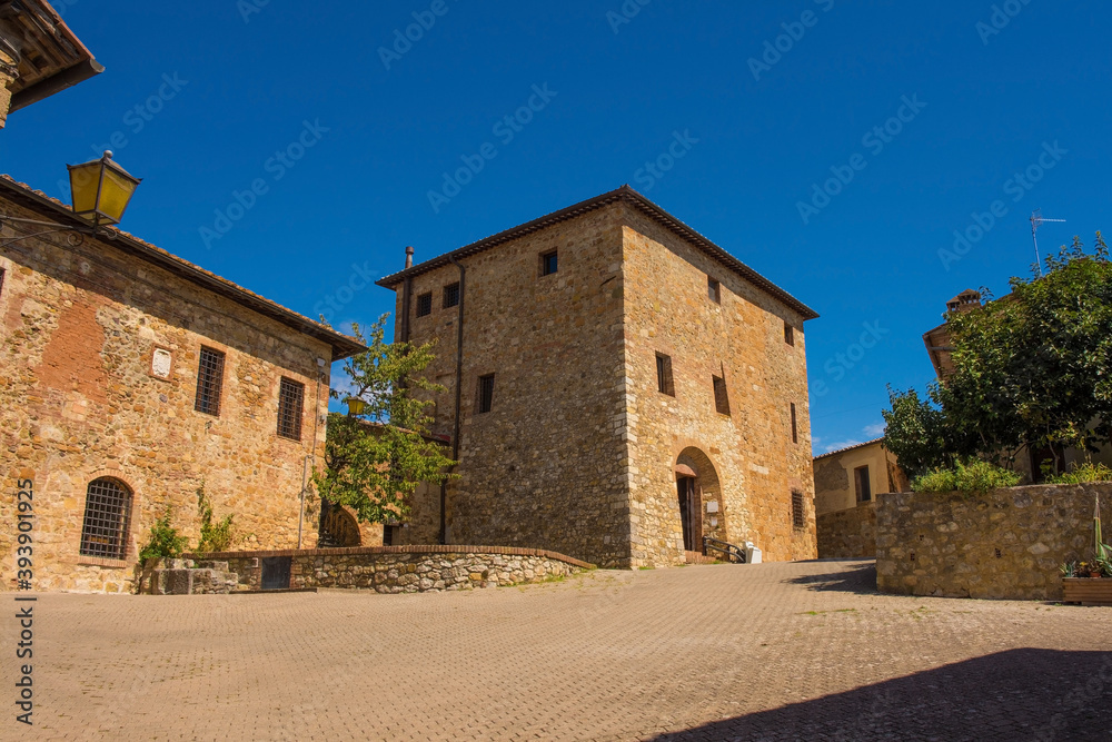 Residential buildings in an historic square in the medieval village of Murlo, Siena Province, Tuscany, Italy
