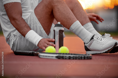 Young tennis player on tennis court