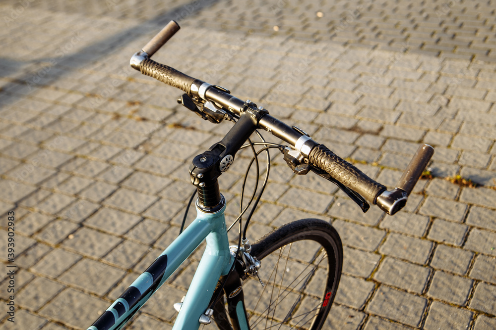 city bike handlebar on the background of the morning sun city bike handlebar on the background of the morning sun