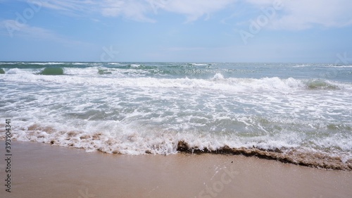 Clear sea water  wave and sand beach.